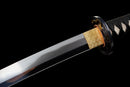 Katana Kohaku — Tamahagane, Poignée noire sur raie blanche, fourreau doré marbré, cordon noir.